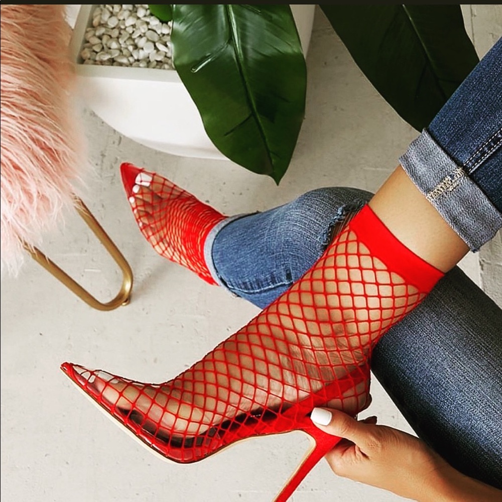 Red fishnet heels